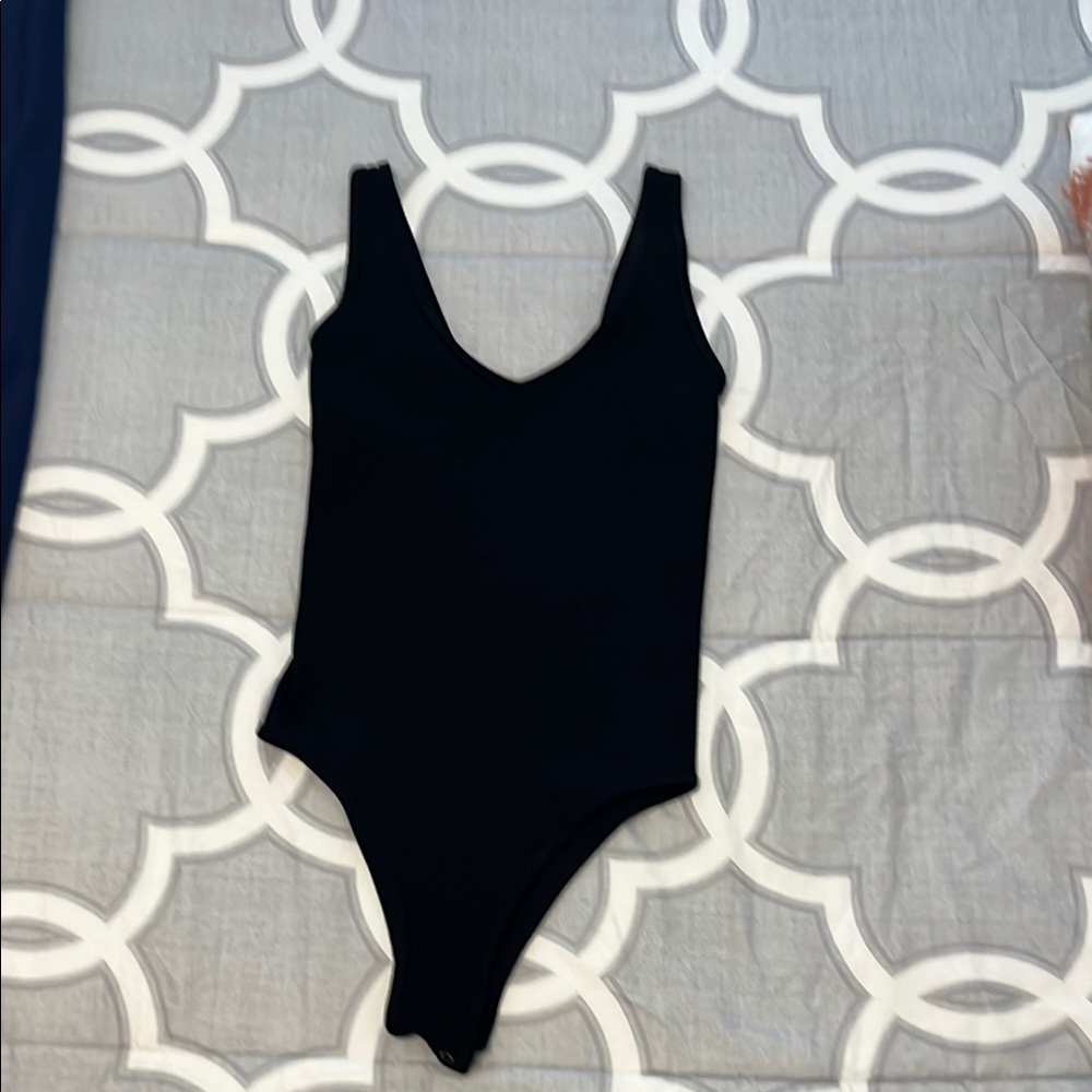 Black Bodysuit with Scoop Neckline and Sleeveless Design